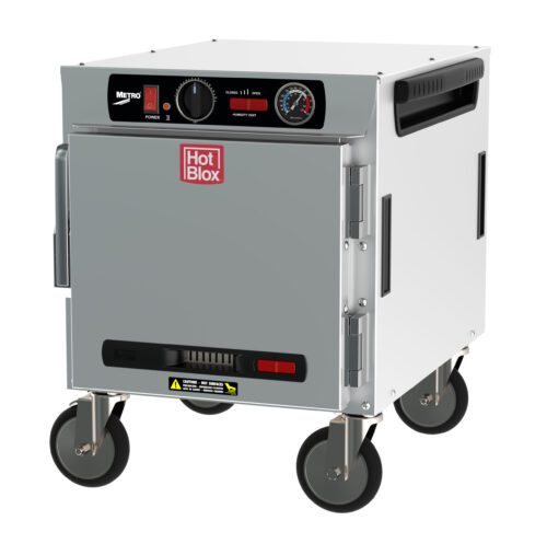 pz7t0h5k00x663fqcd7dml85m65r02xi.jpg The Metro HBCN4-AS-UC HotBlox Narrow 4-Pan Insulated Undercounter Holding Cabinet has a silver body, black and red control panel with a HotBlox logo. It features a NEMA 5-15P plug for 120V, 60Hz operation, four wheels for mobility, and an analog temperature gauge above the door.