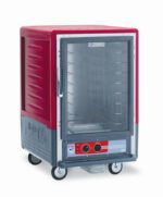 The Metro C535-HFC-4A C5 3 Series Insulated Holding Cabinet has a half-height, full-length clear door, fixed wire slides, and is mobile with wheels. Its red, gray, runs on 120V at 2000W/60Hz, and features a control panel with knobs and a digital display for precision.