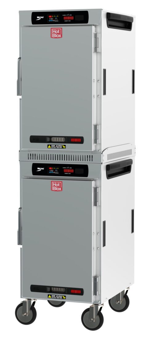 Two Metro HBCN16-DS-M HotBlox Narrow 16-Pan Insulated Dual-Cavity Mobile Holding Cabinets, with solid doors and digital touchscreens, run at 120V and 875W. Stackable on wheels with handles and vents, they ensure efficient food warming and display the HotBlox logo.