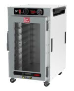 The Metro HBCN8-AC-UC HotBlox narrow 8-pan insulated undercounter holding cabinet, with a clear door and analog controller, operates at 120V, 60Hz, and 875W using a NEMA 5-15P plug, features wheels for mobility and has a Hot Blox label.