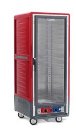 The Metro C539-CLFC-UA C5 3 Series Insulated Holding/Proofing Cabinet, full height in red with a clear full-length door and universal wire slides, operates on 120V and 1440W. Equipped with bottom control dials and mounted on wheels, its designed for easy tray accommodation and mobility.