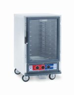 The Metro C515-PXFC-U C5 1 Series Proofing Cabinet is a 1/2 height, stainless steel mobile convection oven with a glass door and universal wire slides. It features a bottom control panel with large knobs and buttons, stands on four wheels, and operates efficiently at 220-240V and 1210-1440W.