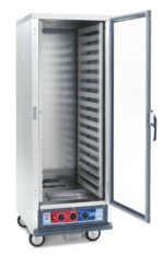 The Metro C519-PFC-LA C5 1 Series Proofing Cabinet is a tall, silver metal storage unit with a clear door, multiple shelves, 1440W power, and operates at 60Hz. Its full height on wheels with a bottom control panel featuring red and blue dials. The door is open to show the spacious interior.