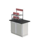 The Metro CR1824TG2B Countertop Order Pickup Station, featuring a sleek black counter and light gray base with doors, is set with red cups and straws. A sign above reads: Mobile Order Pick Up.