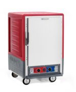 The Metro C535-MXFS-L, a red commercial, insulated moisture heated holding/proofing cabinet on wheels, features a solid full-length door and control panel with two dials and display. This 1/2 height unit operates at 220-240V, 50/60Hz, ideal for transporting and keeping food warm.