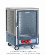 The Metro C535-HXFC-L-GY is a gray, 1/2 height insulated holding cabinet featuring a full-length clear door, lip load aluminum slides, bottom control knobs, side branding, four wheels for mobility, and operates on 220-240V power.
