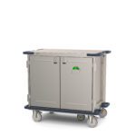 The Metro CaseVue CV36LS-5B Surgical Case Cart with Solid Doors and 5th Wheel Steering measures 45.5W x 28D x 40.625H. It boasts a sturdy, rectangular design with two doors, four wheels for mobility, protective corner bumpers, a side handle, and one door has a green label.