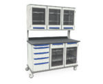 The Metro SXRT38MW14 Starsys Mobile Workcenter is a wheeled cart with blue-handled drawers and glass-front cabinets below, multiple glass-front cabinets above, all built on a sturdy metal frame with a black countertop.