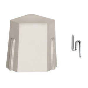 A beige hexagonal cap with a peaked top is on the left of a silver zigzag metal clip against a white backdrop, mimicking the precision of Metro M9995 S Hook Kits for MetroMax i and Q Industrial Plastic Shelving.