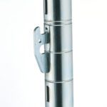 A close-up of a scaffolding joint with a locking mechanism resembles the Metro 9985QS qwikSLOT Shelf Clips, Package of 4. The silver finish shows grooves and a latch, against a plain white background akin to packaging simplicity.