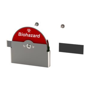 A red disc labeled Biohazard is partially placed in the metallic holder of a Metro CVBIO-RF CaseVue Kit, accompanied by two pegs and a rectangular strip against a white background.
