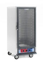 The Metro C517-PXFC-4 C5 1 Series Proofing Cabinet is a 3/4 height unit with a transparent front door and multiple metal racks inside. It operates at 220-240V, 50/60Hz, features control knobs and indicators at the bottom, stands on wheels for mobility, and has a silver exterior with a black and red control panel.
