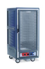 The Metro C537-CLFC-4-BU C5 3 Series Holding/Proofing Cabinet, with a full-length clear door, blue panels, and red control dials, features fixed wire slides and multiple shelves. Its mounted on four wheels for easy mobility, operating at 120V and 1440W to efficiently hold and transport hot food.