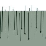 Sleek black poles of varying heights rise from a gray surface, reminiscent of the Metro LBTEK3 qwikTRAK Double Deep Stationary End Unit Kit for Super Erecta Wire Shelving, featuring a Metroseal Green Epoxy finish, elegantly highlighted against a white background.