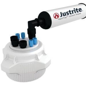 The Justrite VaporTrap Solvent Waste system features a cylindrical device branded with Justrite, attached to a white circular base with blue and black capped ports, using the dependable Justrite Cap model Pp,83Mm,4X1/8,3X1/4,W/Fil for optimal safety and efficiency.