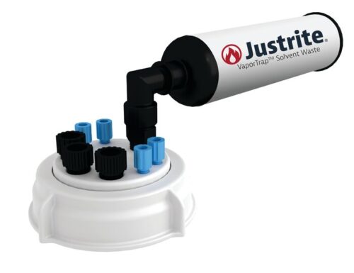 The Justrite VaporTrap Solvent Waste system features a white canister with a 4X1/8 black nozzle, blue and black caps, including the unique Justrite Cap (Pp, 70mm, 4X1/8), on a circular base. The logo and VaporTrap Solvent Waste text are prominently displayed on the canister.