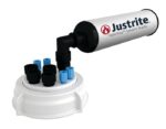 A white cylindrical container labeled Justrite VaporTrap Solvent Waste features a 70mm Justrite Cap with a black nozzle and rests on a circular white base with several black and blue capped openings.