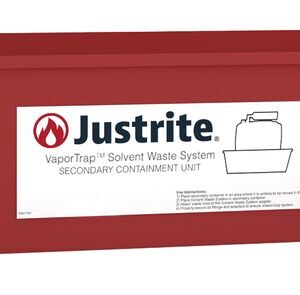 A red rectangular Justrite Spill Basin, compatible with 2.5, 4, 5, or 10L containers, is labeled Justrite VaporTrap Solvent Waste System. It features a stylized flame icon and bottle line drawing, along with usage instructions in black text.