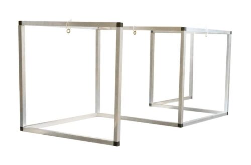 Two Justrite Sd 29X72 rectangular barriers, appearing as metal cube frames with hooks on top centers, are diagonally suspended in white space. One is slightly behind the other, evoking depth and intrigue.