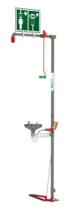 The Justrite H unit features a vertical metal frame with a shower head at the top, an Opn Ss Bowl eyewash basin with levers in the middle, and a foot pedal at the base. Prominent green safety signs are attached above for visibility.