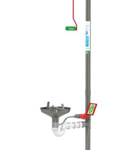 The Justrite H unit features a vertical metal frame with a shower head at the top, an Opn Ss Bowl eyewash basin with levers in the middle, and a foot pedal at the base. Prominent green safety signs are attached above for visibility.