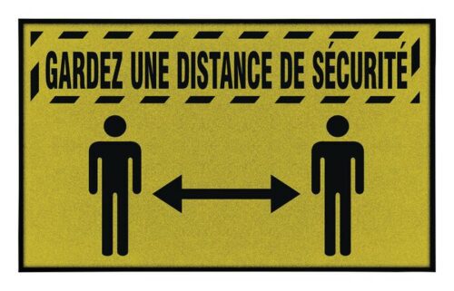 A yellow Justrite Mat displays a black silhouette of two people with an arrow, reading GARDEZ UNE DISTANCE DE SÉCURITÉ above, bordered by black caution lines as a sleek reminder to keep a safe distance.