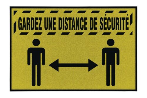 The Justrite Mat features a yellow sign with black borders and diagonal lines, displaying two stick figures separated by an arrow. The French text GARDEZ UNE DISTANCE DE SÉCURITÉ reminds all to KEEP A SAFE DISTANCE.