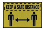 The Justrite Keep A Safe Distance sign is 4 X 6 Ft, featuring text at the top and two stick figures separated by a double-headed arrow to symbolize social distancing.