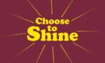 The image displays the 195 Choose To Shine 3X5 Rd. message in bold yellow text on maroon, with radiant yellow rays akin to a Justrite Mat, creating an uplifting effect.