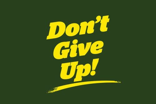 The image features the motivating yellow text Dont Give Up! prominently displayed on a Justrite Mat, 195 Dont Give Up 4X6 Gn with a dark green background and an underline beneath the text.