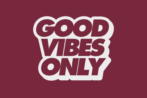 Text graphic displaying GOOD VIBES ONLY in bold, maroon letters with a white outline, echoing the Justrite Mat design, set on a maroon backdrop.