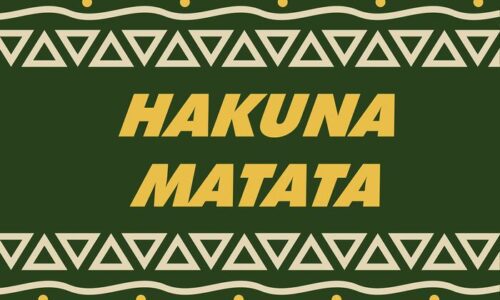 The image displays Hakuna Matata in bold yellow letters on a dark green background, similar to the Justrite Mat, 195 Hakuna Matata 3X5 Gn. The edges feature light green triangles and swirls with yellow dots.
