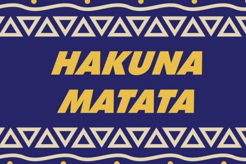 The image features bold yellow Hakuna Matata text on a dark blue background with decorative triangular patterns and yellow dots at the edges. It exudes the playful charm of the Justrite Mat, 195 Hakuna Matata 4X6 Bu, adding whimsy to any space.