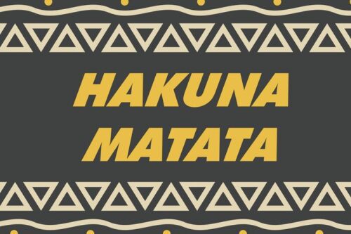 The Justrite Mat,195 Hakuna Matata 4X6 Ch features bold yellow HAKUNA MATATA text on a dark backdrop, surrounded by cream triangular patterns with zigzag lines and dots.