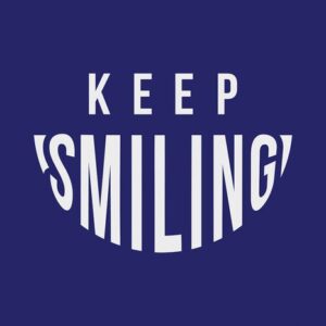 A text graphic on a dark blue background reads KEEP SMILING, with SMILING designed in an elongated, curved style that forms a smile, inspired by the playful aesthetics of the Justrite Mat, 195 Keep Smiling 4X6 Bu collection.