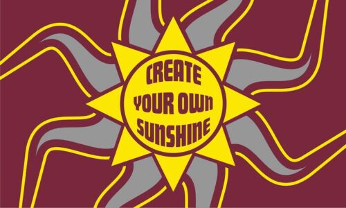 The Justrite Mat, 195 Create Sunshine 3X5 Rd features an illustration of a vibrant sun with gray and yellow rays on a maroon backdrop, centered with the uplifting phrase CREATE YOUR OWN SUNSHINE.