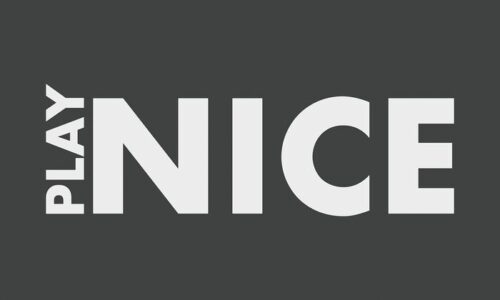 The image displays PLAY NICE in bold, white uppercase letters on a dark gray background. PLAY is vertical and smaller, aligning to the left of the prominent NICE, similar to the layout of a Justrite Mat, 195 Play Nice 3X5 Ch.