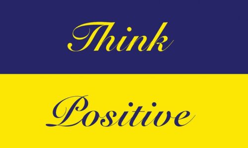This vibrant image showcases a split background: the top half is blue with Think in yellow script, and the bottom is yellow with Positive in blue, echoing the Justrite Mats uplifting design from the 195 Think Positive 3X5 Bu collection.