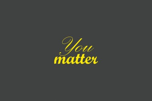 The image highlights a Justrite Mat,195 You Matter 4X6 Ch with a dark grey background and the phrase You matter beautifully scripted in yellow cursive font.