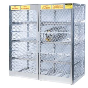 The Justrite Cylinder Locker, 16 Horizontal, is designed with durable diamond-pattern mesh for storing up to 16 cylinders. It includes yellow signs stating No Smoking, Full Cylinders, Empty Cylinders, and Flammable Keep Fire Away. The cage features empty shelves and a chain closure.