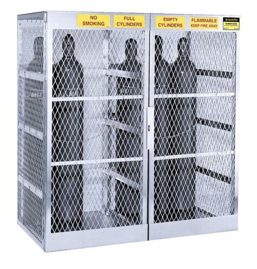 The Justrite Cylinder Locker, 20 Vertical, securely holds numerous gas cylinders in its robust metal cage with mesh doors. It features clear warning signs: No Smoking, Full Cylinders, Empty Cylinders, and Flammable Keep Fire Away.