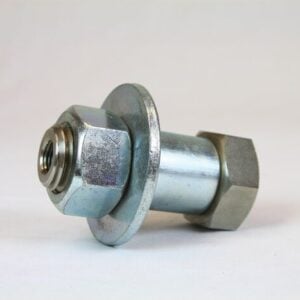 A large metal bolt with a hexagonal nut and washer lies on a light grey surface, resembling a component from the Justrite Pass-Thru Kit, Nitrogen. The shiny bolt and nut feature a metallic sheen with a smooth cylindrical shaft extending from the washer.