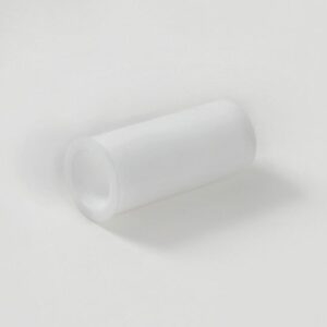 A plain, cylindrical Justrite Sleeve, Punct Pin, 5017, Aeroslv lies horizontally against a light grey backdrop, casting a subtle shadow beneath it.