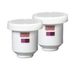 The Justrite Filter, Clr Cartrdg, 2Pk, Aersolv set includes two white cylindrical filters with clear sections showing pink pellets. Each filter has a flat top labeled READY and REPLACE for easy maintenance and efficient status monitoring.