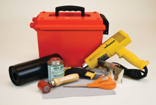 Discover our Justrite Repair Kit, Modified PVC Fabric, offering a variety of crafting tools and materials including a red plastic toolbox, yellow heat gun, black vinyl roll, adhesive can and brush, red roller, utility knife, silver cutter, orange scissors, and gray modified PVC fabric sheet.