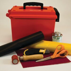 A red toolbox with a black handle is surrounded by a PVC Justrite Repair Kit without a heatgun, including black and yellow fabric, HH-66 can, utility knife, orange scissors, wooden-handled tool with red top, and red sandpaper.