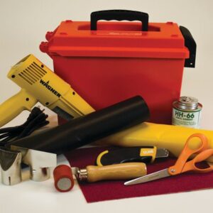 A collection of vinyl crafting tools includes a red toolbox, yellow heat gun, and the Justrite Repair Kit with PVC coated fabric. It features adhesive cans, cutting tools, scissors, a tube, and PVC fabric for your projects.