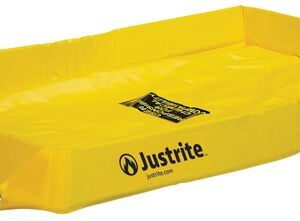 A yellow Justrite Spill Berm 2X4X4 containment tray with slightly raised edges is designed for spill control and includes a caution label inside.
