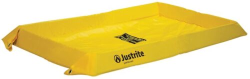 A yellow Justrite Spill Berm 2X4X4 containment tray with slightly raised edges is designed for spill control and includes a caution label inside.