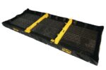The Justrite Berm in black and yellow features three interlocking grated sections for effective spill containment and is ideal for capturing liquids, with elevated sides displaying the brand name. Its robust design mirrors the Decon3 6X16X8 model.